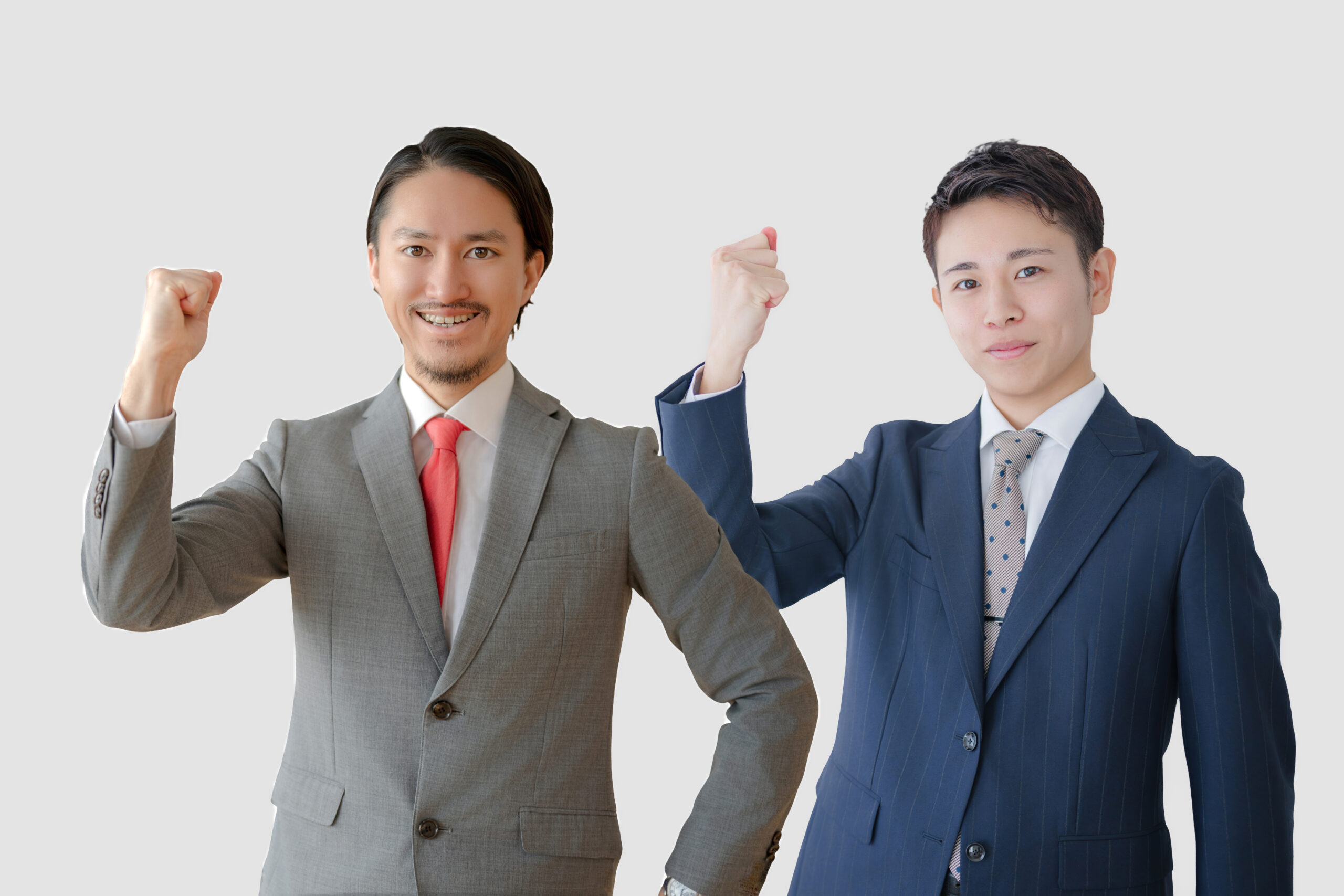 ガッツポーズするビジネスマン達