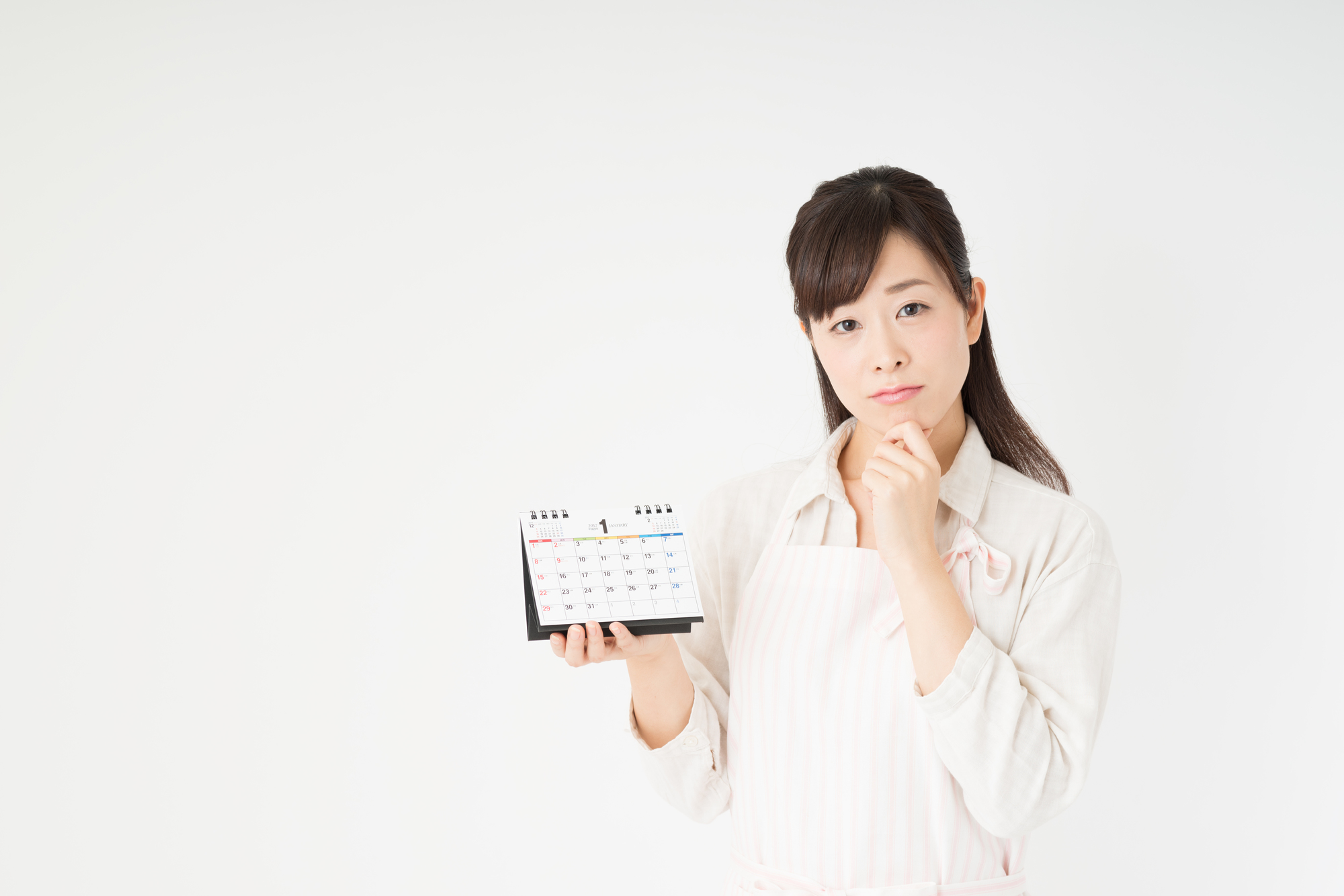 カレンダーを持つ女性